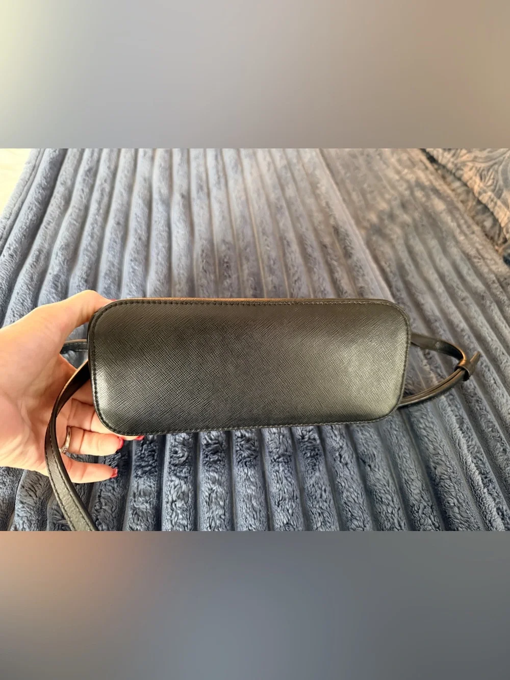 Kate Spade New York Payton Dome Crossbody in black saffiano leather.